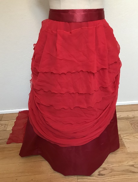 1870s Reproduction Red Polyester Overskirt Front. 