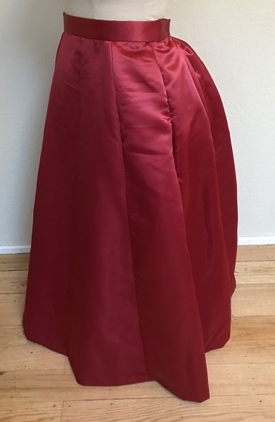 1870s Reproduction Red Polyester Underskirt Left Quarter View.