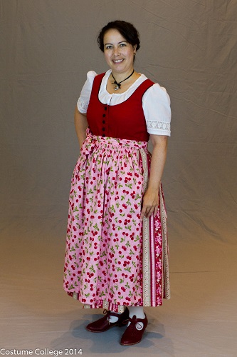 Red Dirndl with pink cherry apron. Photo by Andrew Schmidt.