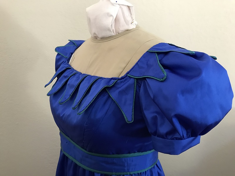 Reproduction 1820s Blue Dress with Van Dyke Points Bodice Left Quarter View.