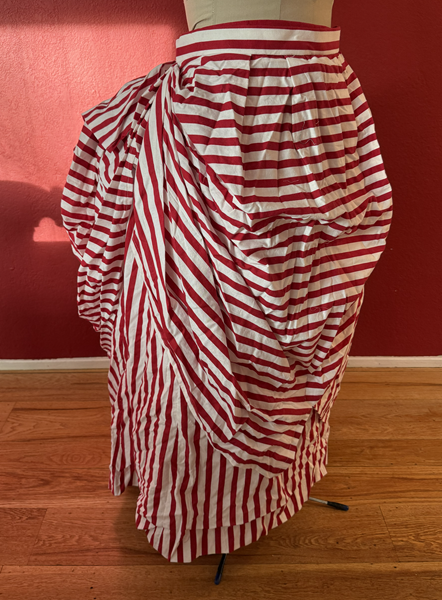 Reproduction 1887 Red Striped Overskirt Right Quarter View.Truly Victorian TV367 